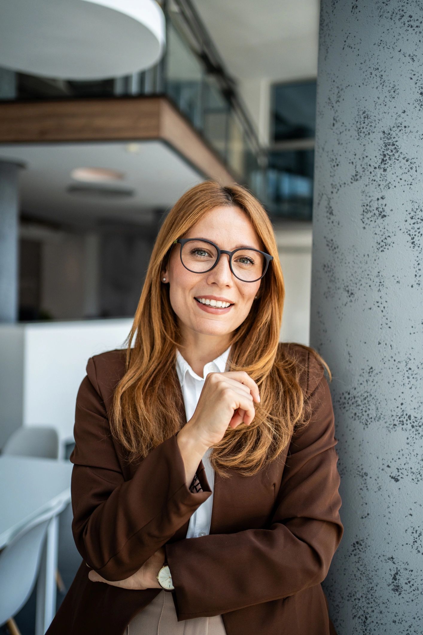 Professional consultant standing confidently in a modern office